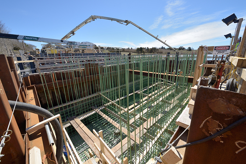 Examples of mass concrete placements include bridge piers, structural columns, mat slabs, girders, footings, and thick slabs