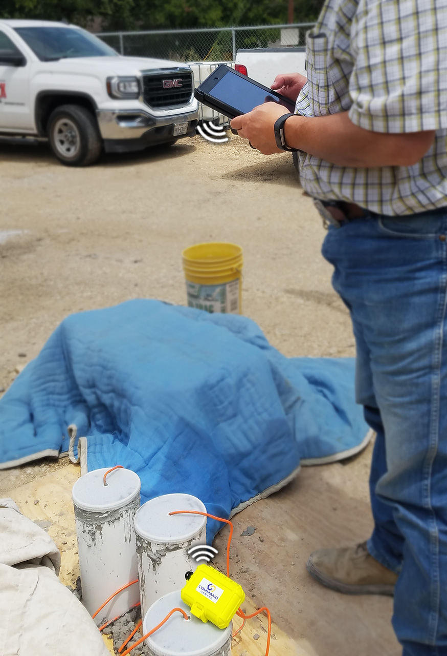 srm-communicating-with-ipad4 Man using iPad to read sensor data via sensor reader module.